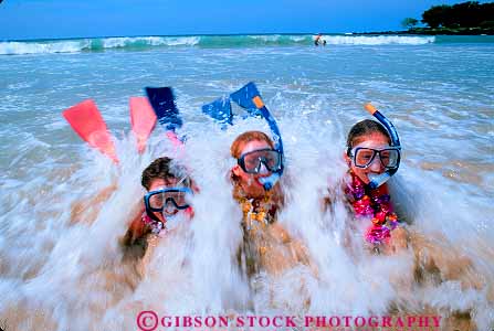 Stock Photo #11407: keywords -  beach beaches children destination dive equipment friend friends fun girl girls hawaii horz in leis ocean play playing recreation released sea snorkel splash surf three travel vacation water wave waves with