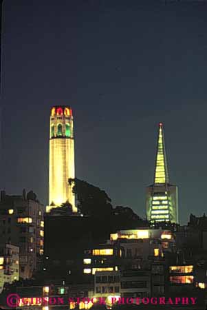 Stock Photo #10586: keywords -  and architecture attraction building california coit commemorate commemorates contrast contrasting contrasts cylinder cylindrical dark design different dusk evening francisco illuminate illuminated landmark landmarks lighting monument monuments new night old round san style tall tourist tower towers tradition traditional transamerica vert