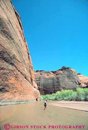 Stock Photo #15992: keywords -  american arizona canyon canyons chelly de desert eroded erosion geology historic history in indian monument national native navajo reservation river rock ruins sacred sandstone site sites stream vert walking wall west western woman