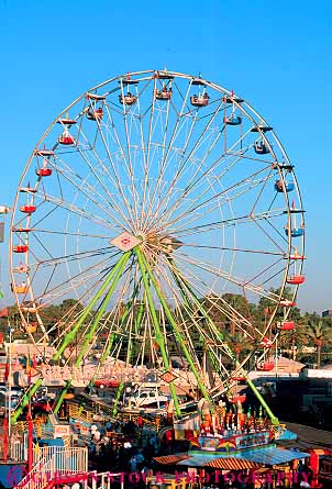 Stock Photo #17742: keywords -  activity amusement annual arizona circle circles circular elevate event events fair fairs ferris festival festivals fun overhead park parks phoenix radial radially recreation ride round rounded shape shaped shapes spoke spokes state summer symmetrical symmetry vert wheel wheels