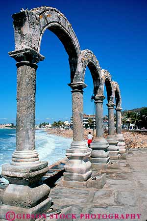 Stock Photo #12829: keywords -  arch arches coast coastal country destination foreign historic history malecon mexico old puerto resort resorts stone travel tropical vacation vacations vallarta vert vintage waterfront