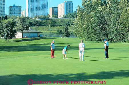 Stock Photo #18630: keywords -  alberta canada course courses edmonton golf golfer golfers golfing golfs horz park people person play playing public recreation sport summer victoria