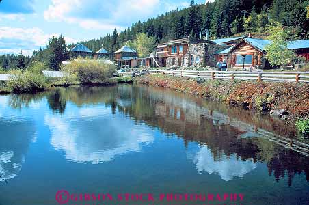 Stock Photo #18507: keywords -  cowboy frontier horz montana mountain old pond reflecting reflection region rocky state town towns vintage wagon west western wheel wheels wood wooden