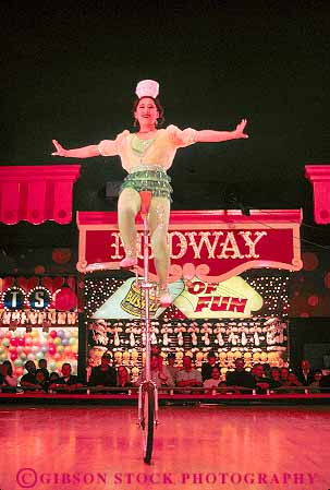 Stock Photo #17660: keywords -  balance balanced balances balancing bike bikes casino circus entertain entertaining entertainment entertains nevada people performance performer performers performing performs person reno show showing shows unicycle unicycles vert woman