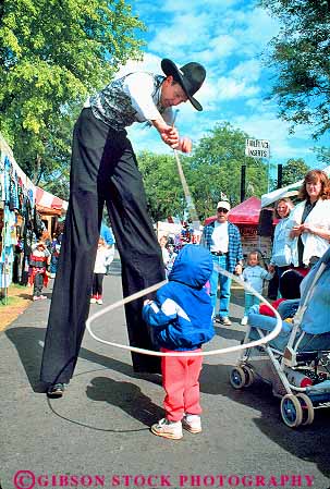 Stock Photo #18473: keywords -  activities activity annual boy child children costume costumed costumes cowboy cowboys entertain entertaining entertainment entertains event events fair fairs festival festivals girl interstate lasso lassoer lassoing lassos leisure loop loops man men northwest people public region rope ropes roping skill skills social spokane state stilt stilts vert washington