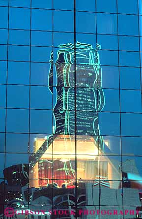 Stock Photo #17320: keywords -  abstract abstraction abstracts architecture building buildings dallas dark design downtown dusk evening glass in lighting lights modern night office reflect reflecting reflection reflects style texas urban vert window windows