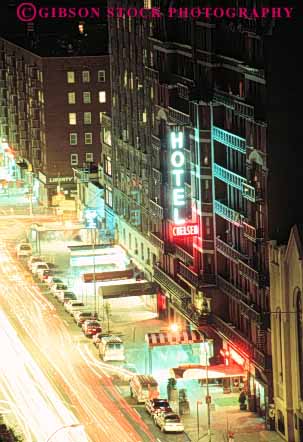 Stock Photo #9102: keywords -  city dark dusk hotel illuminated lighting lights new night shops signs store stores street vert york