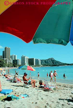 Stock Photo #13051: keywords -  beach beaches destination hawaii hawaiian island islands leisure oahu people recreation sand shore travel tropical umbrella vacation vert waikiki