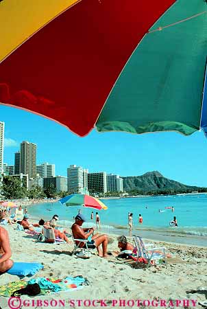 Stock Photo #11736: keywords -  beach coast coastal destination hawaii oahu ocean recreation resort resorts sand shore shoreline sunbath sunbathers sunbathing travel tropical umbrella vacation vert waikiki