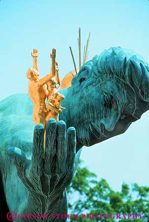 Stock Photo #19147: keywords -  art detail detroit gold golden hand hands human landmark michigan of people person public sculpture sculptures spirit statue statues symbol symbols vert