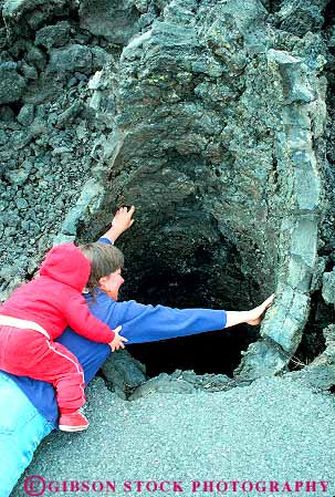 Stock Photo #18338: keywords -  bend cast casts child formation formations hole into lands lava looking mother mould moulds new northwest oregon people person recent released tree vert volcanic volcano volcanos with young