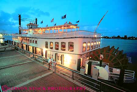 Stock Photo #17462: keywords -  attraction boat boats creole dark dock dusk evening horz lighting lights louisiana mississippi new orleans queen river riverboat riverboats rivers shore tour tourist tours