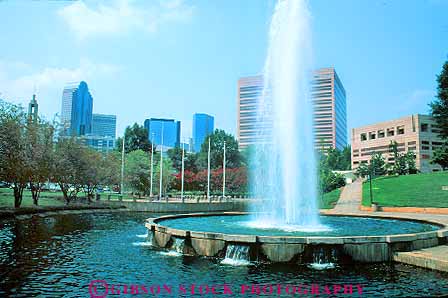 Stock Photo #18008: keywords -  business carolina center centers charlotte cities city cityscape commercial district downtown fountain fpountains horz in landscape marshall north park parks pond ponds public skyline spray spraying sprays squirt squirting squirts up upward upwards urban water