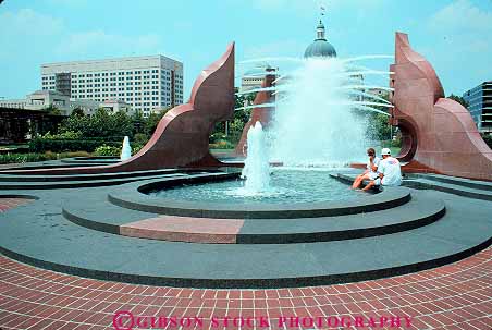 Stock Photo #11949: keywords -  capitol commons couple downtown fountain horz in indiana indianapolis man midwest park parks plaza plazas relax relaxed relaxing sit sitting woman
