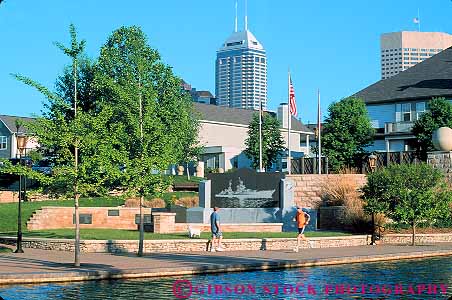 Stock Photo #18028: keywords -  building buildings business canal center centers cities city commercial development district downtown exercise exercising horz indiana indianapolis inthe jog jogger joggers jogging jogs park parks people person plaza public rivers run runner running runs sidewalk urban water