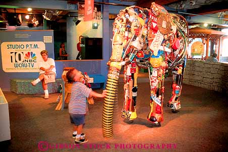 Stock Photo #11182: keywords -  boy child children display displays elephant exhibit exhibits horz learn learning made material materials museum museums of pennsylvania philadelphia please recycle recycled recycling see touch touching