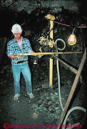 Stock Photo #14829: keywords -  career cave cavern caverns caves demo demonstrate demonstrates demonstrating equipment geologic geological geology hardhat historic history idaho job jobs machine machinery man men metal mine miner miners mining occupation precious rock shaft shafts sierra silver tool tools underground vert wallace work worker workers working works