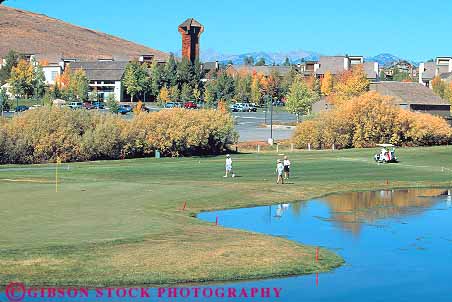 Stock Photo #14900: keywords -  communities community course destination elkhorn golf golfer golfers golfing golfs grass horz idaho landscape lawn mountain mountains people person recreation region resort resorts rocky scenery scenic sport summer sun travel vacation valley