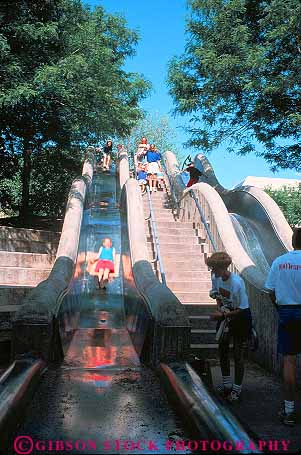 Stock Photo #15384: keywords -  central child children gravity great in kid kids leahy mall malls metal nebraska omaha park parks people plain plains play playing public region slide slides sliding state summer vert youth