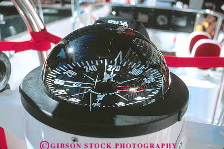 Stock Photo #15543: keywords -  bearing bearings compass compasses degrees direction directions dome glass horz magnetic navigate navigates navigating navigation round sailboat spherical