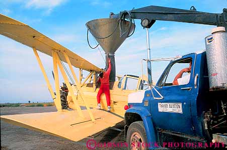 Stock Photo #15695: keywords -  application applies apply applying california chemical colusa crop dose doses dosing duster horz insecticide into irradiate irradiates irradiation kill kills load loading man men plane planes plant plants spray sprayed sprays squirt squirting squirts treat treatment treatments treats