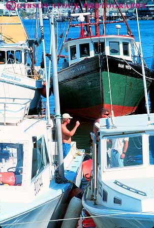 Stock Photo #15733: keywords -  boat boats business coast coastal commercial dock fish fisherman fishermen gloucester harbor industrial industry job jobs marina maritime massachusetts ocean port sea shore shoreline vert water work worker workers working works