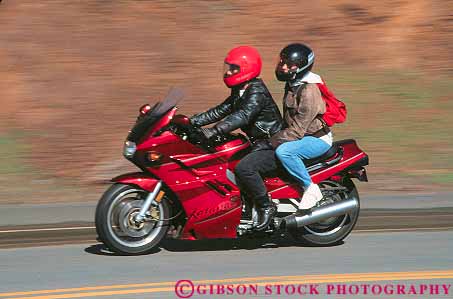 Stock Photo #15804: keywords -  action blur blurred couple drive driver drives driving dynamic helmet helmets horz motion motorcycle motorcycles move movement moves moving road roads street streets travel traveling vehicle