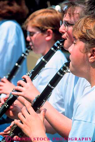 Stock Photo #15815: keywords -  adolescent children clarinet clarinets finger fingers flutes girls group groups instrument instruments music musical musician musicians people perform performance performer performers person player playing plays reed show showing shows sound student students teen teenage teenager teenagers teens vert wind young youth