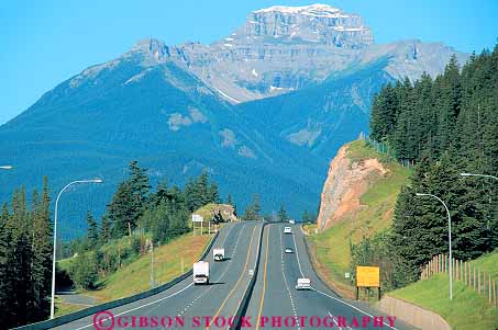 Stock Photo #16065: keywords -  above alberta auto automobiles autos banff canada car cars divided drive drives driving elevate elevated freeway freeways highway highways horz hwy interstate landscape mountain mountains overhead overview pavement road roads rocky route routes scenery scenic street streets system traffic transport transportation travel vehicles view views