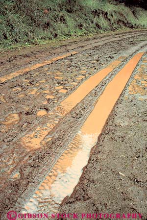 Stock Photo #16101: keywords -  country countryside dirt dirty gooey isolated mess messy mud muddy primitive puddle puddles remote road rural slippery soft straight ugly vert water wet