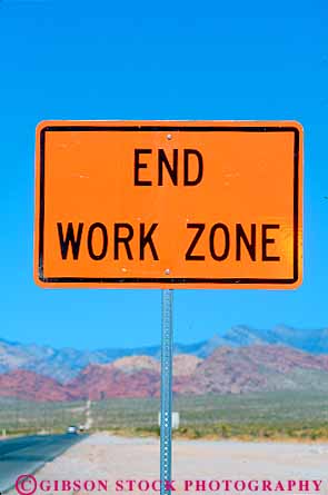 Stock Photo #12614: keywords -  bright caution end highway highways information orange road sign signs vert warning work working works zone