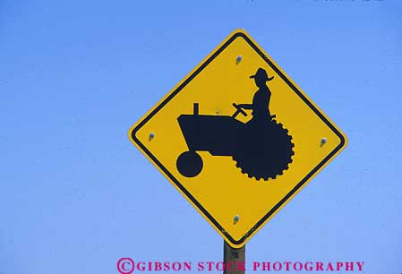 Warning Sign Slow Moving Farm Equipment Ahead On Road Stock Photo 19944