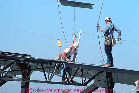 Stock Photo #17079: keywords -  beams build building builds care career careful caution commercial constructing constructs contruction danger fall hard hat high horz injury iron job jobs man men new occupation people person risk risky site sites stand standing stands steel walk work worker workers working works