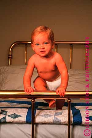 Stock Photo #1790: keywords -  baby bed child cute diaper happy healthy infant model play released smile stand vert