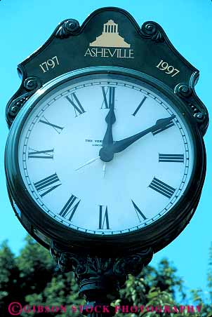 Stock Photo #12527: keywords -  asheville carolina circle circular clock clocks display displaying displays hand hands indicate indicating indication indicator north number numbers numeral numerals roman rotate rotates rotating rotation round show showing shows time vert