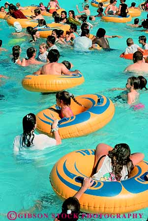 Stock Photo #16680: keywords -  boy boys child children destination float floats flotation fun girl girls hot inner kid kids las material materials nevada outdoor outdoors outside park people person plastic play playing pool pools recreation summer swim swimmer swimmers swimming swims synthetic travel tube tunes vacation vegas vert water wet wild young youth