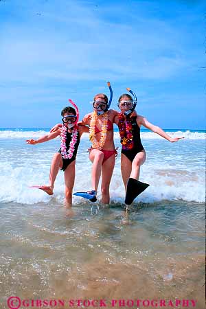 Stock Photo #11412: keywords -  beach beaches children destination dive equipment friend friends fun girl girls hawaii in lei leis ocean play playing portrait recreation released sea snorkel splash surf three travel vacation vert water wave waves with