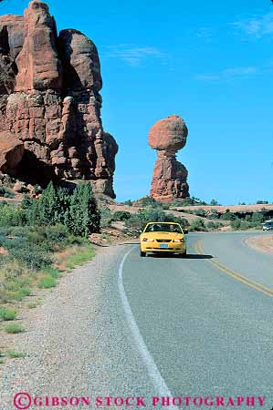 Stock Photo #16890: keywords -  arches auto automobile automobiles autos car cars cruise cruising drive driven drives driving landscape motion move moves moving national park parks pavement public road scenery scenic street streets transportation utah vert yellow