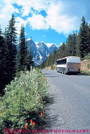 Stock Photo #14621: keywords -  alberta banff bus buses busing canada commercial destination highway landscape mass mountain mountains national park parks public road roads scenery scenic street streets tour touring tours transit transportation travel traveler travelers vacation vehicle vert