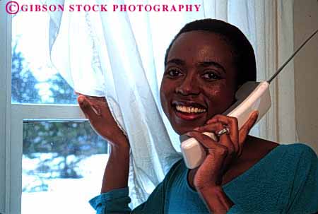 Stock Photo #2341: keywords -  african alone american black communication cordless ethnic female happy home horz house minority outdoor phone private relax released smile summer talk telephone window woman