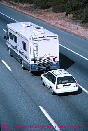 Stock Photo #3207: keywords -  car caution convenient drive highway home large motor motorhome pull recreational risk rv safety second tow travel vacation vehicle vert