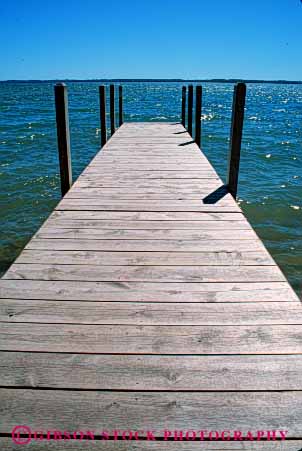 Stock Photo #4911: keywords -  boat calm dock horizon lake landscape michigan parallel pattern scenic shore vert water wood