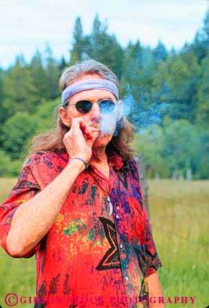 Stock Photo #10927: keywords -  cigarette contraband counter culture drug drugs high hippies hippy illegal joint joints man marijuana men reefer released sixties smoke smoker smokes smoking vert