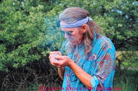 Stock Photo #10929: keywords -  cigarette contraband counter culture drug drugs high hippies hippy horz illegal joint joints man marijuana men reefer released sixties smoke smoker smokes smoking